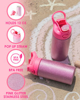 Two pink glitter water bottles sit on top of a chalk drawing. On water bottle is standing upright with the lid open while the other is lying on its side. Four icons are to the left of the water bottles and feature images of the product with product features beneath them. The first icon reads, "Hold 12 OZ." The second reads, "Pop up straw." The third one reads, "BPA Free." The fourth one reads, "Pink glitter stainless steel."