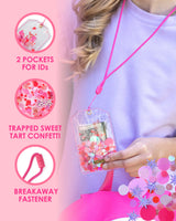 A person wearing a purple shirt holds up a clear ID holder with pink confetti trapped inside. The ID holder is attached to a pink cord around the person's neck. To the left of the person, three icons display product information accompanied by close up shots of the product. The first one reads, "2 pockets for IDs." The second one reads, "Trapped Sweet Tart confetti." The third reads, "Breakaway fastener."