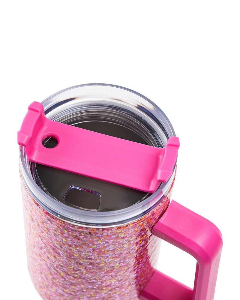 A pink glitter stainless steel tumbler stands against a white background. The picture is a close up on the tumbler's lid.