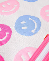 Close up of a blue smiley face on a white knit backpack. 