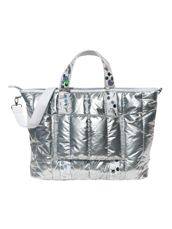 A silver duffle bag with iridescent confetti straps and a white detachable shoulder strap.