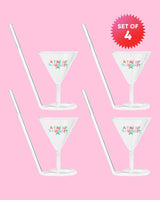 Set of 4 'A Tini Bit Naughty' martini glasses with built-in straw shot against pink background. 