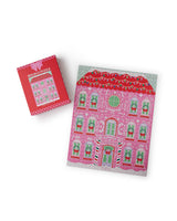 500 piece pink and red gingerbread house puzzle shot against white background.