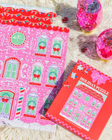 Gingerbread house puzzle and ornament sippers shot against white fur background. 