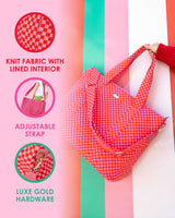 Infographic on left side explaining features of large pink and red checkered duffel bag, which include knit fabric with lined interior, adjustable strap, and luxe gold hardware.