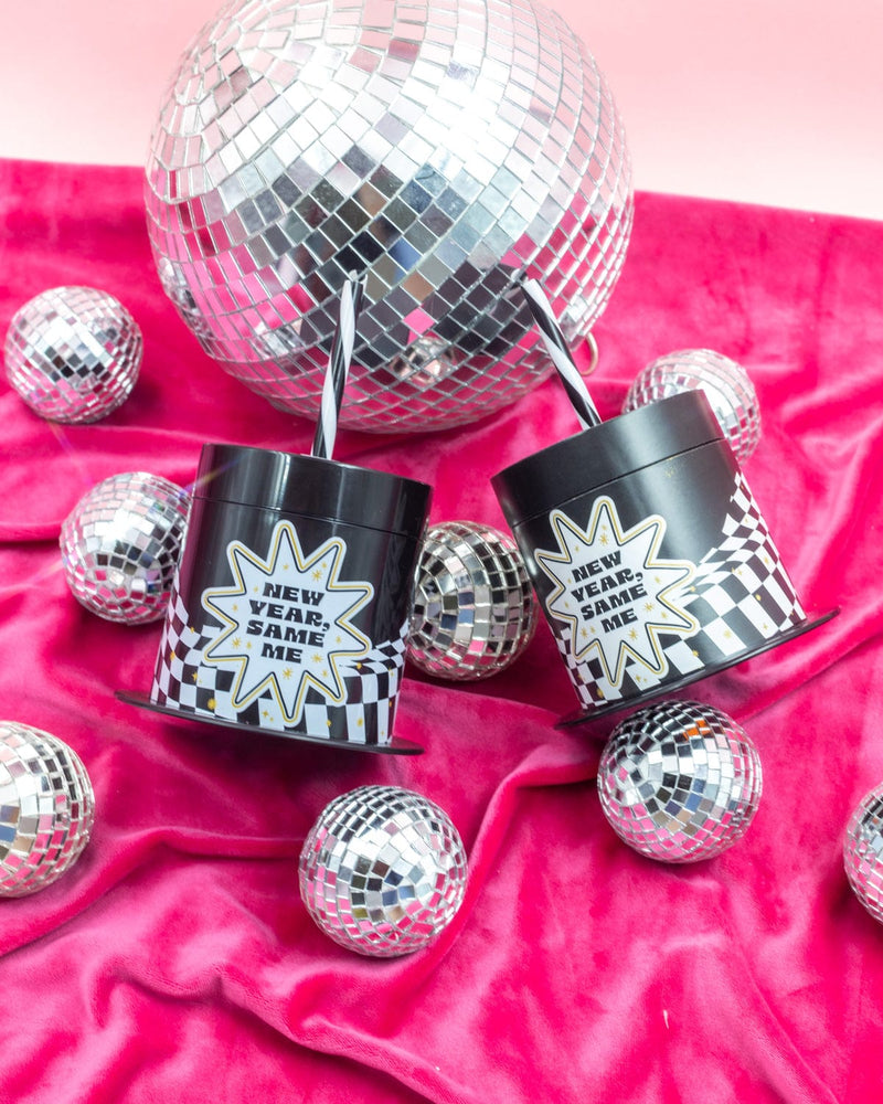 'New Year, Same Me' Sippers with disco decor shot against pink background. 