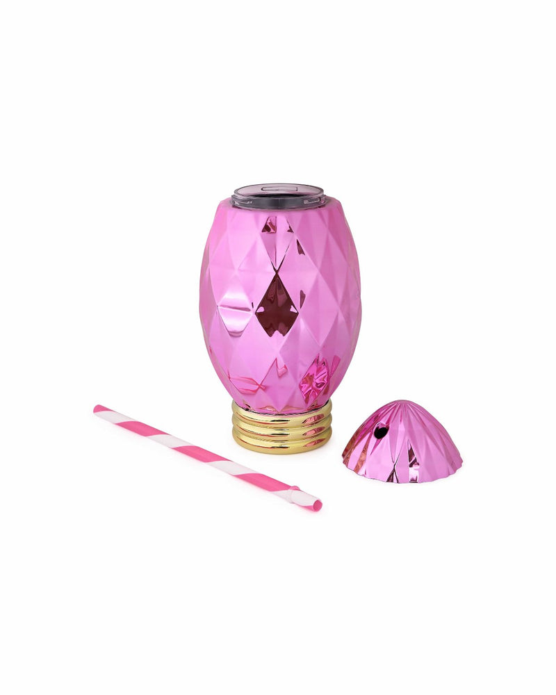 Pink faceted electroplated sipper with striped pink and white straw and lid laying flat shot against white background. 