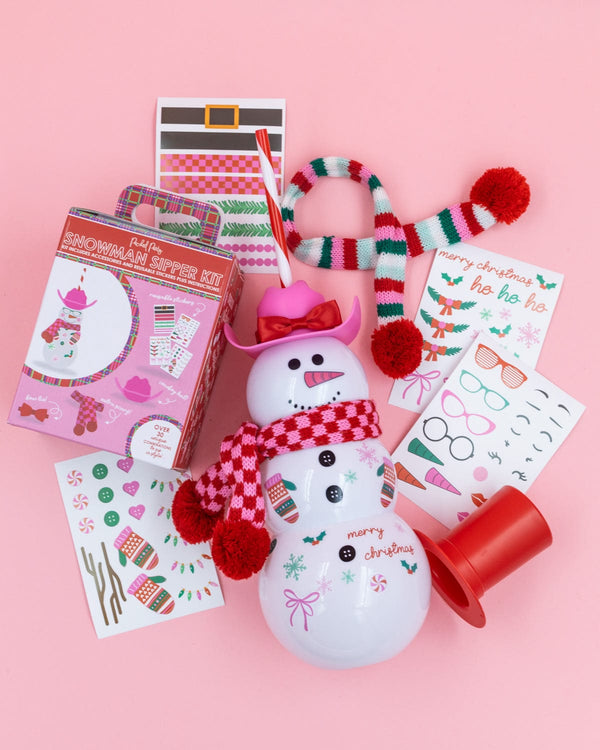 Snowman Sipper Accessory Bundle items shot against pink background. 